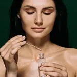 woman applying skincare serum